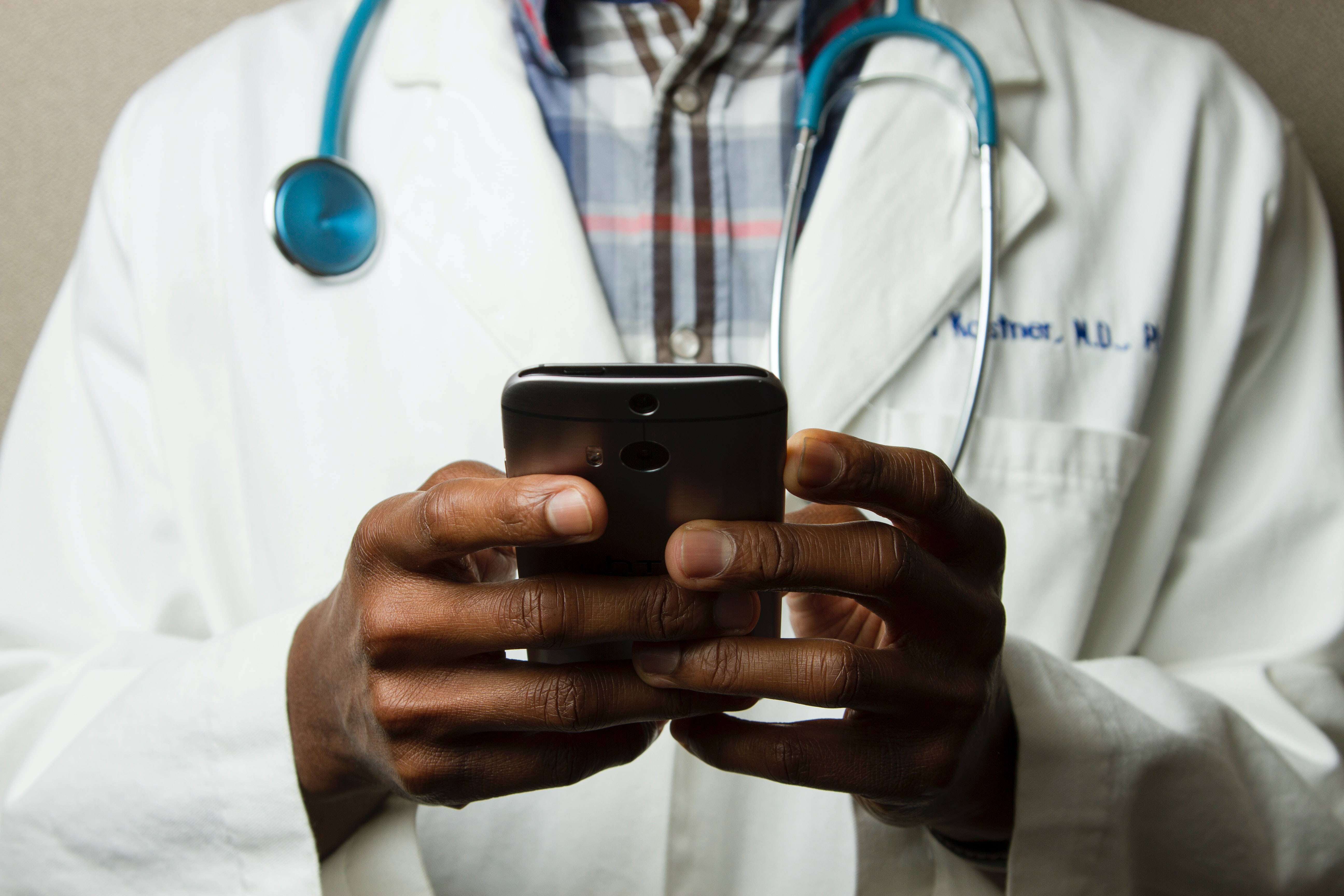 image of doctor on a smart phone